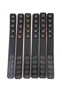 Flat view of six 1" wide coloured cockrings with black leather lining visible.