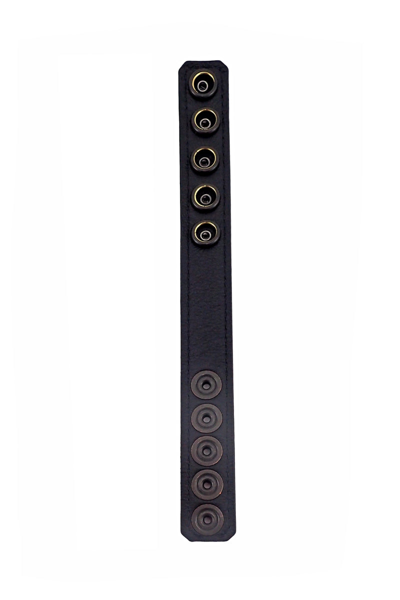 A black leather cockring positioned flat, highlighting the black leather lining.