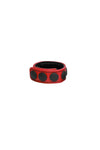 A 1" wide red leather cockring with matte black hardware, in a coil.