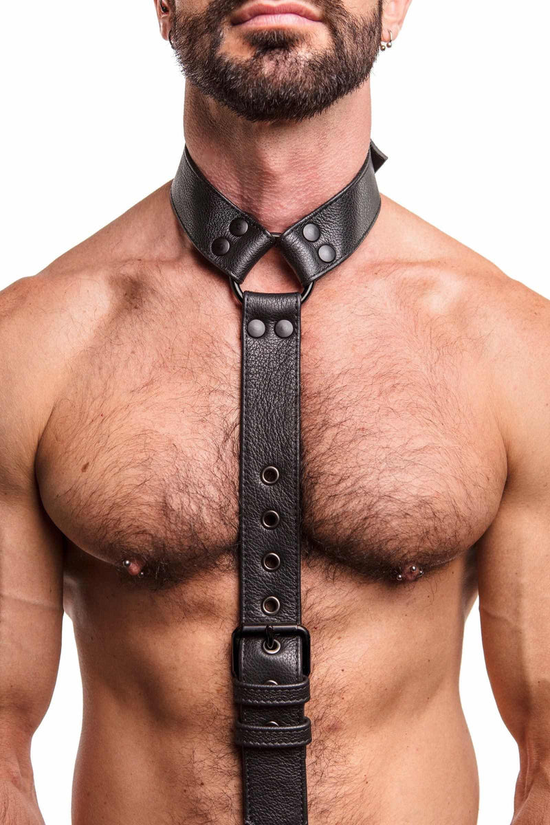 Close-up of male model wearing a 1.5" wide ARMY OF MEN black leather cockstrap collar with matte black hardware.