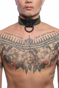 Front-on shot of striking model wearing a 1.5" wide ARMY OF MEN CHEVRON COLLAR - Army Green with a matte black hardware.