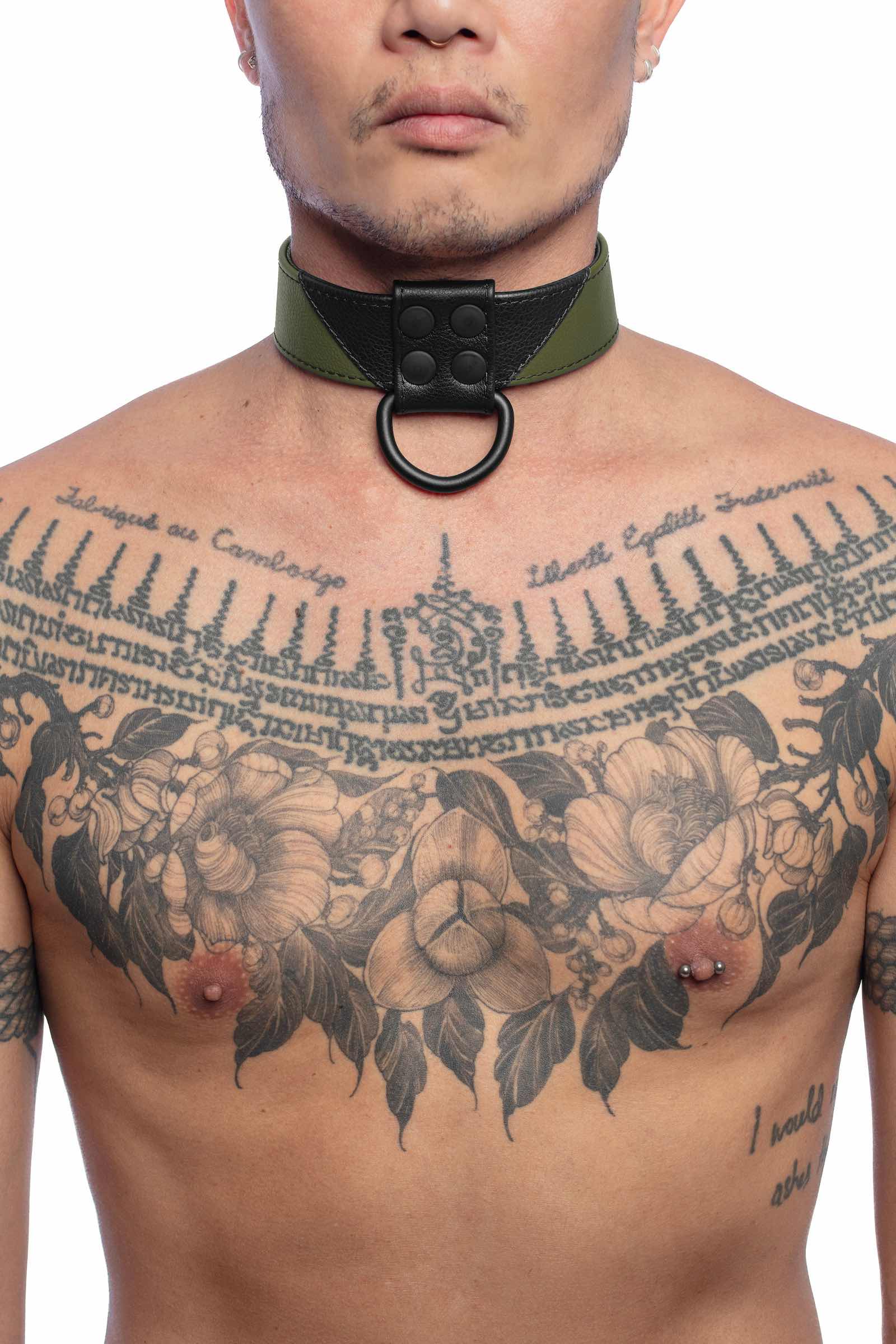 Front-on shot of striking model wearing a 1.5" wide ARMY OF MEN CHEVRON COLLAR - Army Green with a matte black hardware.