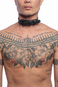 ARMY OF MEN 1" wide black leather collar with matte black hardware styled on a male model, facing forward.