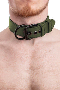 Tight shot of male model wearing a 1.5" wide ARMY OF MEN army green leather collar with matte black hardware.