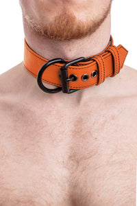 A 1.5" wide ARMY OF MEN CLASSIC COLLAR WIDE - Orange with matte black hardware, worn by a ginger haired model, close-up view.