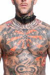 Front-on shot of striking model wearing a 1.5" wide ARMY OF MEN COMBAT COLLAR WIDE - Army Green with a matte black buckle.