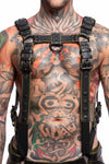 A 1.5" wide ARMY OF MEN FULL COMBAT KIT - Army Green connected to a jockstrap, worn by a tattooed male model.