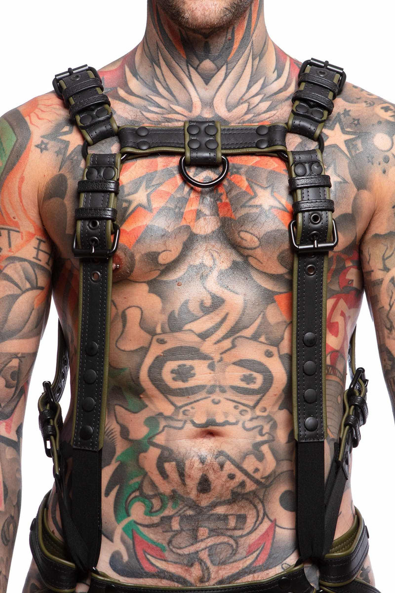 A 1.5" wide ARMY OF MEN FULL COMBAT KIT - Army Green connected to a jockstrap, worn by a tattooed male model.