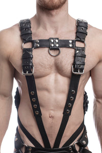 A ginger haired model wearing a 1.5" wide ARMY OF MEN FULL COMBAT KIT - Stainless Steel connected to a cockring, front view.