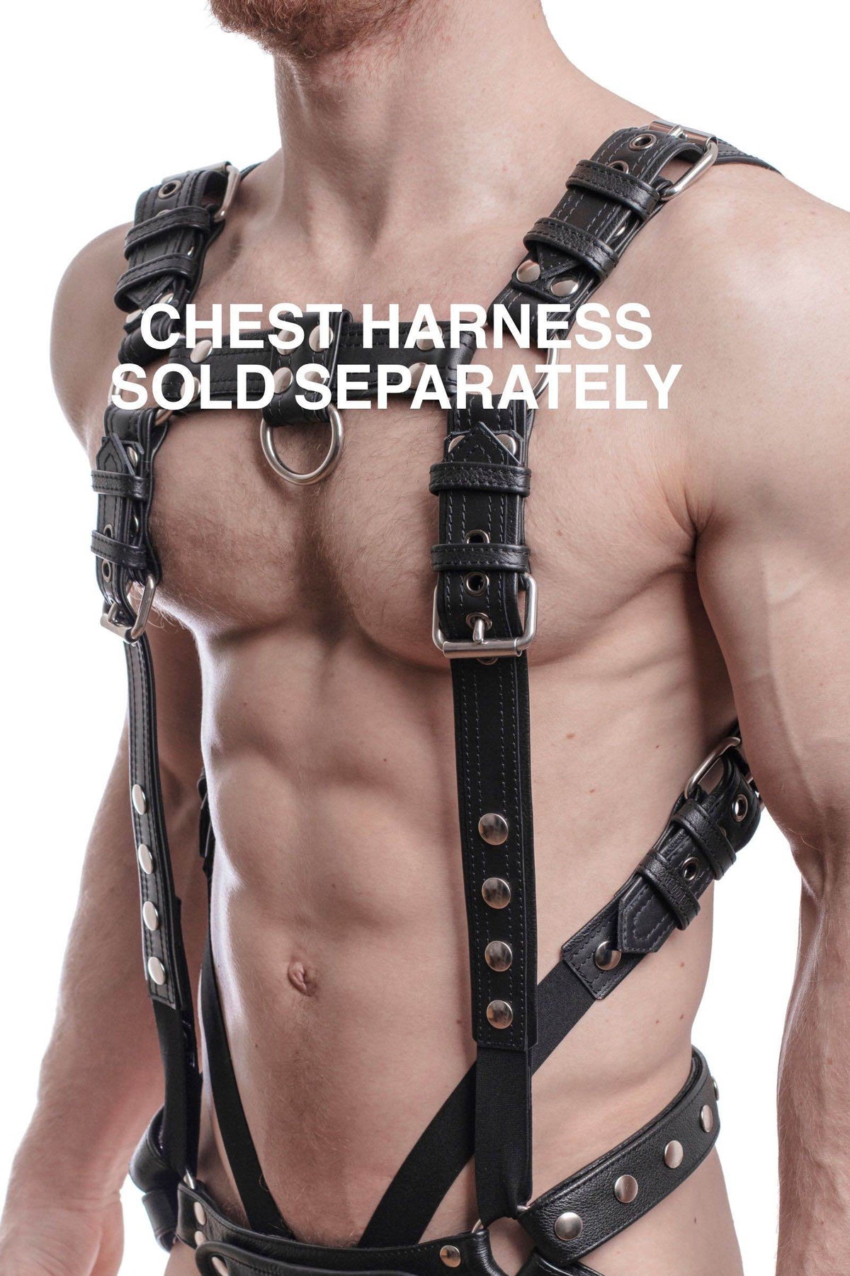 Three-quarter view of model in an ARMY OF MEN black leather combat bulldog add-on, connected to a cockring and jockstrap.