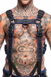 Front view of a toned model wearing a 1.5" wide ARMY OF MEN FULL COMBAT KIT - Blue, connected to a cockring and a jockstrap.