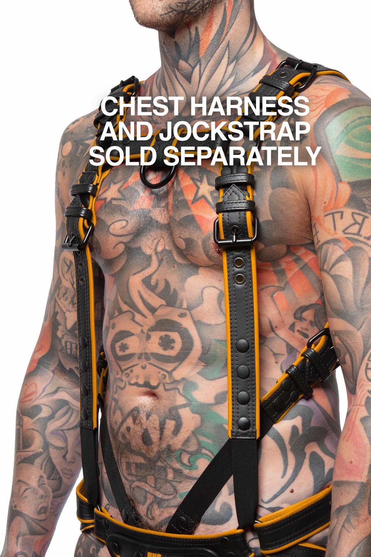 ARMY OF MEN COMBAT CONNECTOR - Yellow connected to a cockring and jockstrap, styled on a toned model, in three-quarter pose.