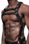 Angled view of a model in an ARMY OF MEN black leather Full Universal X Kit with matte black O-rings. Front straps parallel.