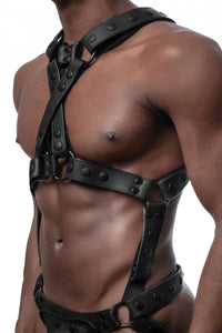 Three-quarter view of Black model in an ARMY OF MEN Full Universal X Kit - Black with black hardware. Worn vertically.