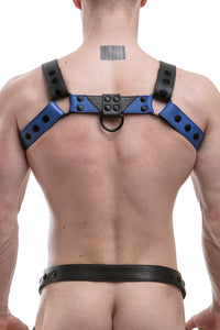 Back shot of chiselled model wearing a 1.5" wide ARMY OF MEN CHEVRON BULLDOG - Blue with matte black rivets.