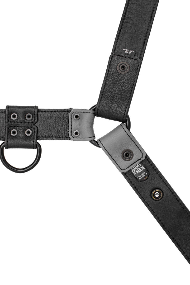 A 1.5" wide ARMY OF MEN CHEVRON BULLDOG - Grey with matte black metal hardware, laid flat and displaying the lining leather.