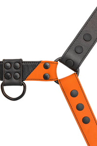 Flat lay view of a 1.5" wide ARMY OF MEN CHEVRON BULLDOG - Orange with matte black rivets, snaps, O-rings, and D-rings.