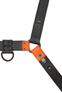 A 1.5" wide ARMY OF MEN CHEVRON BULLDOG - Orange with matte black hardware, displayed flat and displaying the lining leather.
