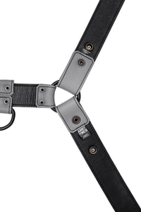 ARMY OF MEN 1.5" wide grey leather chest harness with matte black rivets, laid flat and showing the lining leather.