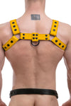 Male model turned away in a 1.5" wide ARMY OF MEN yellow leather bulldog harness with matte black rivets.