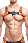 Front view of ginger haired model in an ARMY OF MEN CLASSIC BULLDOG - Orange with black rivets, snaps, O-rings, and D-rings.