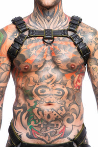 Male model wearing an ARMY OF MEN army green and black leather Combat Bulldog harness with black hardware, front facing view.