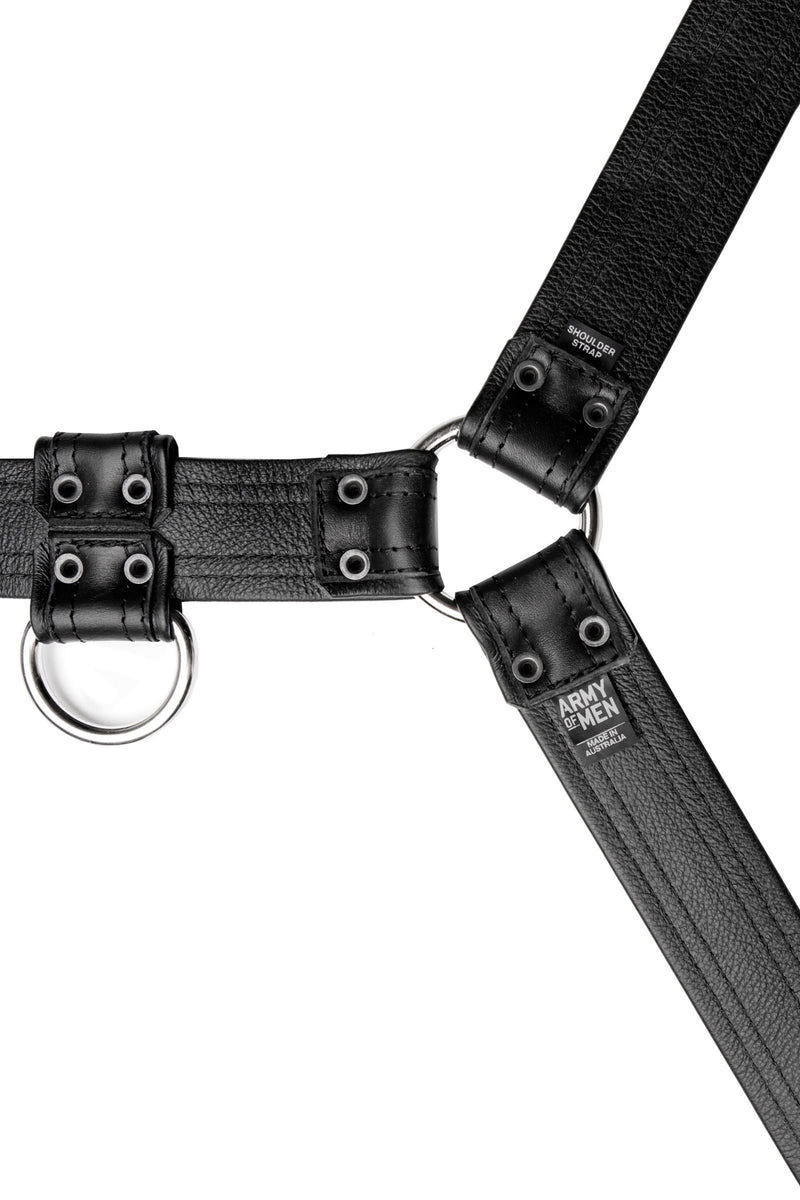 A 1.5" wide ARMY OF MEN black leather bulldog harness with stainless steel hardware, laid flat and displaying the lining.