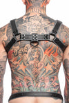 A tattooed model in a 1.5" wide ARMY OF MEN COMBAT BULLDOG - Grey with matte black O-rings, back view.