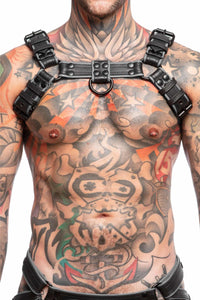 Front-on shot of male model wearing an ARMY OF MEN grey and black leather Combat Bulldog harness with matte black O-rings.