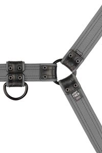 An ARMY OF MEN grey and black leather Combat Bulldog harness with matte black hardware, laid flat and revealing the lining.