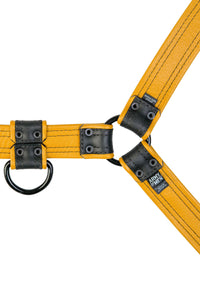 ARMY OF MEN 1.5" wide yellow and black leather harness with matt black hardware, laid flat and displaying the lining leather.