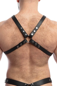 Male model turned away wearing a 1" wide ARMY OF MEN black leather harness with stainless steel snaps, and O-rings.