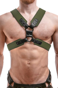 Male model wearing a 2" wide ARMY OF MEN COMMANDER X HARNESS - Army Green with matte black O-rings, front facing view.