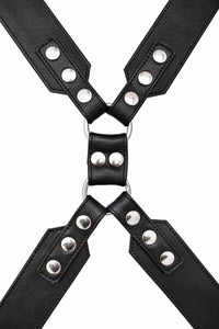 A 2" wide ARMY OF MEN black leather chest harness with stainless steel hardware, laid flat and captured from above.