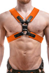 Male model in a 2" wide ARMY OF MEN COMMANDER X HARNESS - Orange with black rivets, snaps, and O-rings, front facing view.