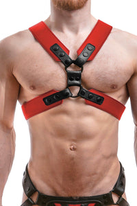 A muscular model facing forward wearing a 2" wide ARMY OF MEN red and black leather chest harness with matte black hardware.