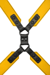 Flat lay view of a 2" wide ARMY OF MEN yellow and black leather chest harness with matte black snaps.