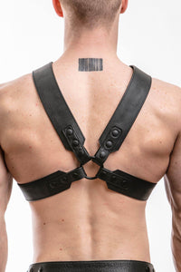 Back view of muscular model in a 2" wide ARMY OF MEN SERGEANT X HARNESS - Black with matte black snaps.