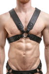 ARMY OF MEN black leather Sergeant X harness with matte black snaps, and O-rings styled on a chiselled model, facing forward.