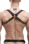 Back view of male model in a 1" wide ARMY OF MEN SHOULDER BUCKLE HARNESS - Army Green with matte black snaps.