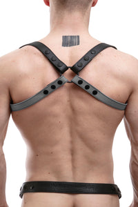 Back shot of male model in a 1" wide ARMY OF MEN grey and black leather shoulder harness with matte black snaps, and O-ring.