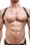 ARMY OF MEN 1" wide black leather harness with matte black snaps styled on a male model, facing forward.