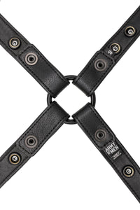 A 1" wide ARMY OF MEN black leather harness with matte black hardware, laid flat and showing the lining leather.