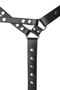 An ARMY OF MEN black leather chest harness with stainless steel rivets, snaps, and D-rings, laid flat and viewed from above.