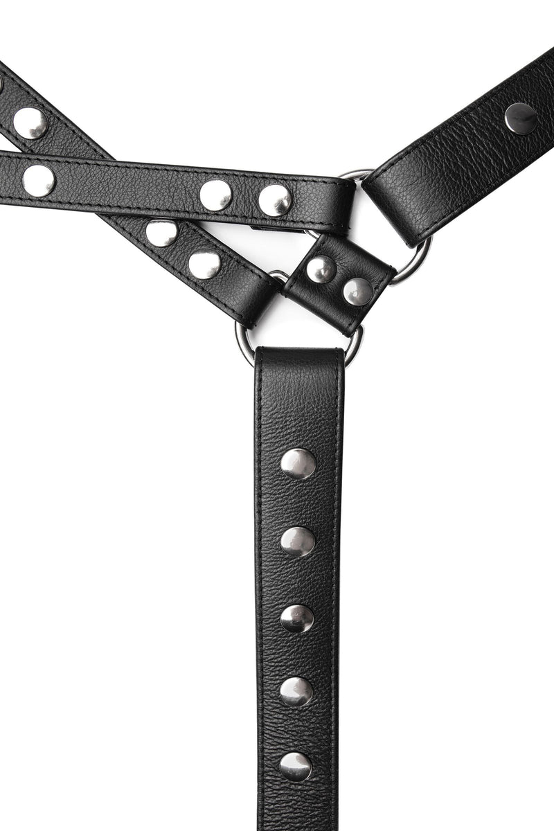 An ARMY OF MEN black leather chest harness with stainless steel rivets, snaps, and D-rings, laid flat and viewed from above.