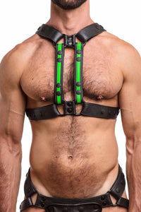 Male model facing forward wearing an ARMY OF MEN black and fluro green leather X harness with matte black snaps.