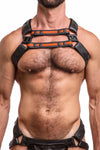 ARMY OF MEN black and fluro orange leather X harness with matt black rivets styled on a male model. Front straps parallel.