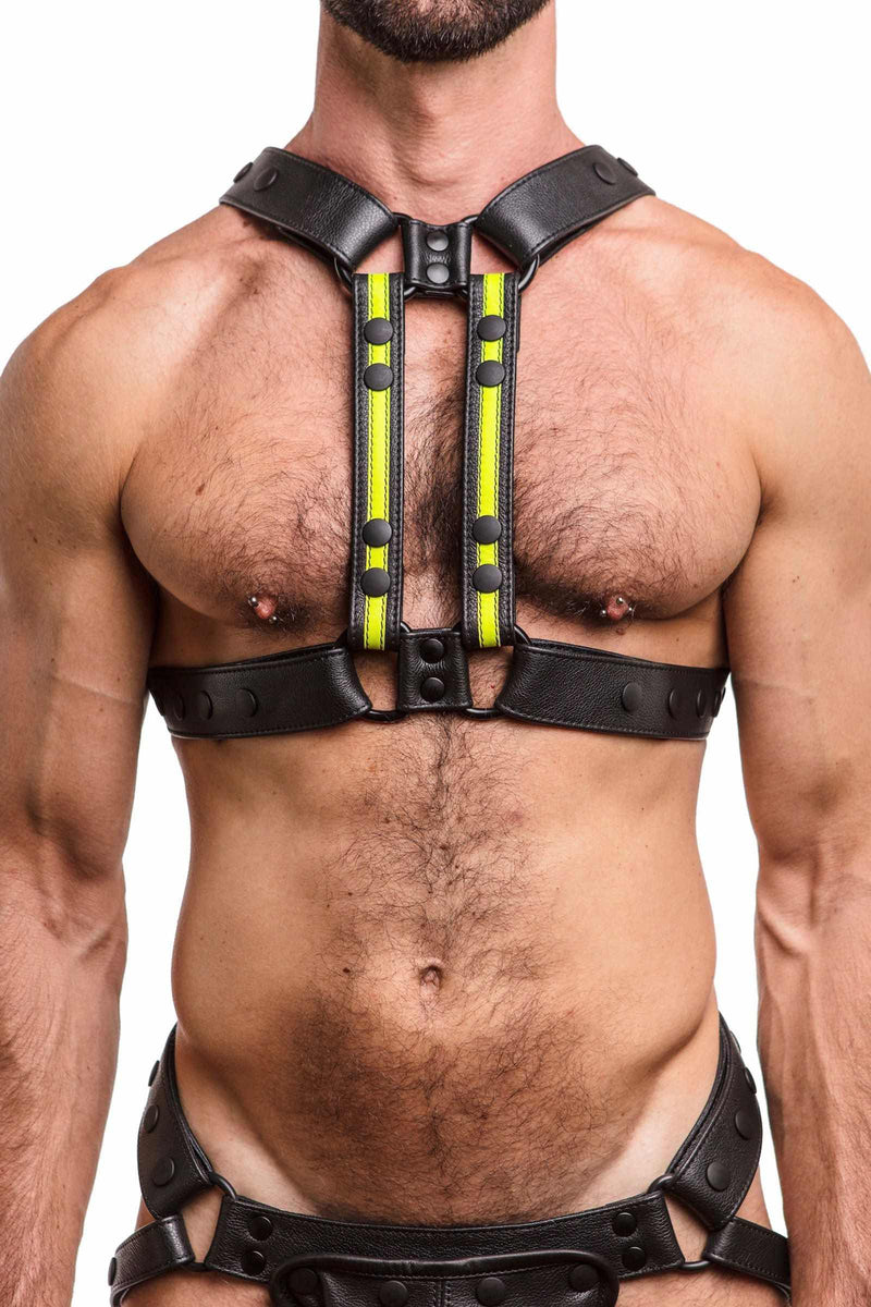 Front-on shot of male model in an ARMY OF MEN black and fluro yellow leather harness with matte black hardware.