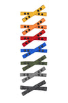 Six pairs of 1" wide ARMY OF MEN UNIVERSAL X STRAPS with matte black snaps, laid flat and viewed from above.