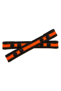 One inch wide black and fluro orange leather Universal X harness front straps with black snaps, laid flat seen from above.